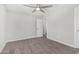 Neutral bedroom with new carpet, a ceiling fan, and a closet at 3933 W Nancy Ln, Phoenix, AZ 85041