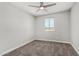 Neutral bedroom with a ceiling fan, new carpet, and updated paint at 3933 W Nancy Ln, Phoenix, AZ 85041
