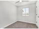 This bedroom features neutral paint, carpet, a ceiling fan, and a window providing natural light at 3933 W Nancy Ln, Phoenix, AZ 85041