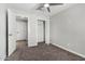 This bedroom features neutral paint, carpet, a ceiling fan, and a closet and is ready for your personal touch at 3933 W Nancy Ln, Phoenix, AZ 85041