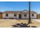 Charming single-story home featuring a well-maintained exterior and a spacious front yard at 3933 W Nancy Ln, Phoenix, AZ 85041