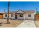 Charming single-story home featuring a well-maintained exterior and a spacious front yard at 3933 W Nancy Ln, Phoenix, AZ 85041
