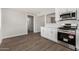 Modern kitchen offers stainless steel appliances and white cabinets at 3933 W Nancy Ln, Phoenix, AZ 85041