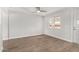 Bright living room featuring new hardwood floors and fresh paint at 3933 W Nancy Ln, Phoenix, AZ 85041