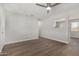 Bright living room features modern ceiling fan and wood-look flooring at 3933 W Nancy Ln, Phoenix, AZ 85041