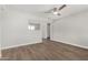 Bright living room boasts ceiling fan and modern wood-look flooring at 3933 W Nancy Ln, Phoenix, AZ 85041