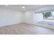 Clean, sun-filled bedroom featuring hardwood floors, a ceiling fan and neutral color scheme at 4031 W Palmaire Dr, Phoenix, AZ 85051