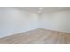 Clean, sun-filled bedroom featuring hardwood floors and neutral color scheme at 4031 W Palmaire Dr, Phoenix, AZ 85051