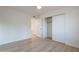 Bedroom with new floors and a closet at 4031 W Palmaire Dr, Phoenix, AZ 85051