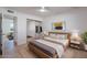 Cozy bedroom with natural light, streamlined closet, and calming decor for a peaceful retreat at 4031 W Palmaire Dr, Phoenix, AZ 85051