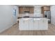 Beautiful kitchen boasts a large island, white countertops, and stainless steel appliances at 4031 W Palmaire Dr, Phoenix, AZ 85051