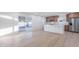 Spacious open-concept kitchen and dining area with island, stainless appliances, and sliding glass doors at 4031 W Palmaire Dr, Phoenix, AZ 85051