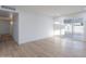 Spacious living room with new floor, fresh paint, and sliding glass doors at 4031 W Palmaire Dr, Phoenix, AZ 85051