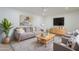 Bright living room featuring modern furnishings, neutral tones, and stylish decor for a comfortable ambiance at 4031 W Palmaire Dr, Phoenix, AZ 85051