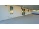 Spacious patio area with white brick, access door, and sliding glass door for indoor/outdoor living at 4031 W Palmaire Dr, Phoenix, AZ 85051