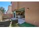 Cozy back patio with outdoor seating that opens into a kitchen with modern appliances and a breakfast bar at 4242 E Erie St, Gilbert, AZ 85295