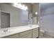Well-lit bathroom features dual sinks, a large mirror, white vanity and a shower-tub combo at 4242 E Erie St, Gilbert, AZ 85295