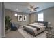 Comfortable primary bedroom with neutral walls, ample natural light, and stylish contemporary furnishings at 4242 E Erie St, Gilbert, AZ 85295