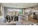 Bright dining area with backyard view, kitchen island, modern table, and stylish chairs set for a comfortable meal at 4242 E Erie St, Gilbert, AZ 85295