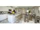 Well-equipped kitchen features a center island, granite countertops, stainless steel appliances, and stylish seating at 4242 E Erie St, Gilbert, AZ 85295