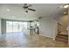 Bright kitchen and dining area with tile floors, stainless appliances, island, and staircase at 4242 E Erie St, Gilbert, AZ 85295