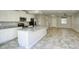Well-lit kitchen with stainless steel appliances, granite countertops, and large central island at 4242 E Erie St, Gilbert, AZ 85295