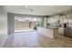 Modern kitchen featuring stainless steel appliances, granite countertops, white cabinets, and a kitchen island at 4242 E Erie St, Gilbert, AZ 85295