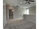 Spacious loft area featuring neutral walls, plush carpeting, ceiling fan and a partial railing at 4242 E Erie St, Gilbert, AZ 85295