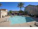 Community pool with ample seating and a desert landscape at 4242 E Erie St, Gilbert, AZ 85295