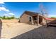 Spacious backyard featuring low-maintenance gravel landscaping and a covered patio area at 42758 W Camino De Janos --, Maricopa, AZ 85138
