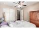 Bedroom featuring a window, closet, and ceiling fan at 42758 W Camino De Janos --, Maricopa, AZ 85138