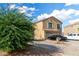 Two story house with desert landscaping, a two-car garage and neutral colored stucco exterior at 42758 W Camino De Janos --, Maricopa, AZ 85138