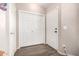 Bright hallway featuring wood-look floors and a closet with double doors at 42758 W Camino De Janos --, Maricopa, AZ 85138