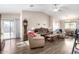 Inviting living room with vaulted ceilings, wood flooring, and cozy furniture arrangement at 42758 W Camino De Janos --, Maricopa, AZ 85138