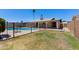 The backyard features a pool, a grassy area, and a view of the home at 4325 W Sierra St, Glendale, AZ 85304