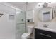 Modern bathroom featuring a glass-enclosed shower, updated vanity, and stylish fixtures for a spa-like experience at 4325 W Sierra St, Glendale, AZ 85304