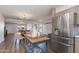 Well-lit kitchen featuring stainless steel appliances, modern cabinetry, and an adjacent dining area for easy living at 4325 W Sierra St, Glendale, AZ 85304