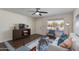 Cozy living room with comfortable seating, a ceiling fan, and natural light, perfect for relaxation and entertaining at 4325 W Sierra St, Glendale, AZ 85304