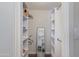 Organized walk-in closet with ample shelving, rods, and storage space to keep your wardrobe neat and accessible at 4325 W Sierra St, Glendale, AZ 85304