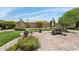 Private backyard featuring a well-manicured lawn, a charming patio set, and mature landscaping at 4401 E Barwick Dr, Cave Creek, AZ 85331
