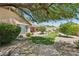Expansive backyard with lush artificial turf, mature trees, and a covered patio for outdoor living at 4401 E Barwick Dr, Cave Creek, AZ 85331