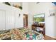 Bright bedroom with vaulted ceiling, golf course art, and an entertainment center at 4401 E Barwick Dr, Cave Creek, AZ 85331