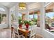 Cozy breakfast nook bathed in natural light from the surrounding large windows, with backyard views at 4401 E Barwick Dr, Cave Creek, AZ 85331