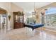 Elegant dining area includes large windows with plantation shutters, providing natural light and views into the adjacent living space at 4401 E Barwick Dr, Cave Creek, AZ 85331