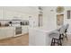 Well-appointed kitchen boasts an island with seating, double oven, and ample storage, merging style with everyday functionality at 4401 E Barwick Dr, Cave Creek, AZ 85331