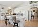 Open kitchen showcases a large island with bar stool seating, white cabinets, and modern appliances for a welcoming space at 4401 E Barwick Dr, Cave Creek, AZ 85331