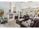 Inviting living room with vaulted ceiling, fireplace, tile floor, and comfortable seating at 4401 E Barwick Dr, Cave Creek, AZ 85331