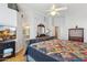 Main bedroom with wood floors, a large bed and TV at 4401 E Barwick Dr, Cave Creek, AZ 85331