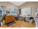 Spacious office or craft room with hardwood floors, natural light, and ample storage space at 4401 E Barwick Dr, Cave Creek, AZ 85331