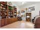 Bright home office with built in shelving, desk, and large window view at 4401 E Barwick Dr, Cave Creek, AZ 85331